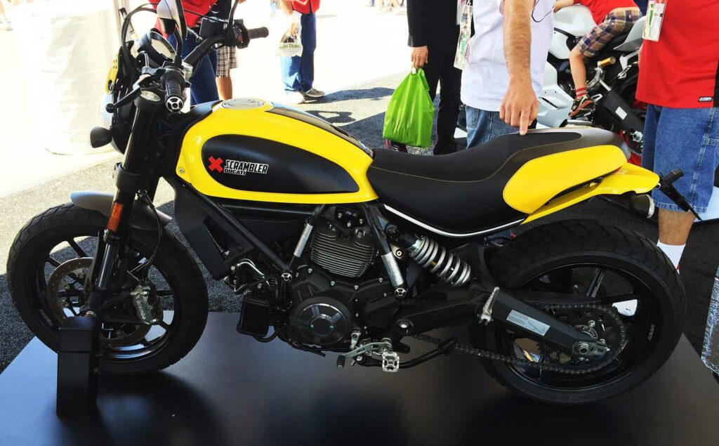 Ducati Scrambler by <a href="https://commons.wikimedia.org/wiki/File:Ducati_scrambler_(19816042301).jpg">Daniel Hartwig</a>, <a href="https://creativecommons.org/licenses/by/2.0">CC BY 2.0</a>
